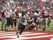 Portland State running back Steven Long (26) celebrates his touchdown against Washington State during the second half of an NCAA college football game, Saturday, Sept. 5, 2015, in Pullman, Wash. Portland State won 24-17.