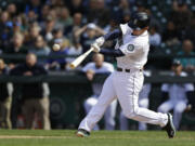 Seattle Mariners' Kyle Seager hits a three-run go-ahead home run in the eighth inning Sunday as the Mariners went on to beat the Texas Rangers 6-5. (AP Photo/Ted S.