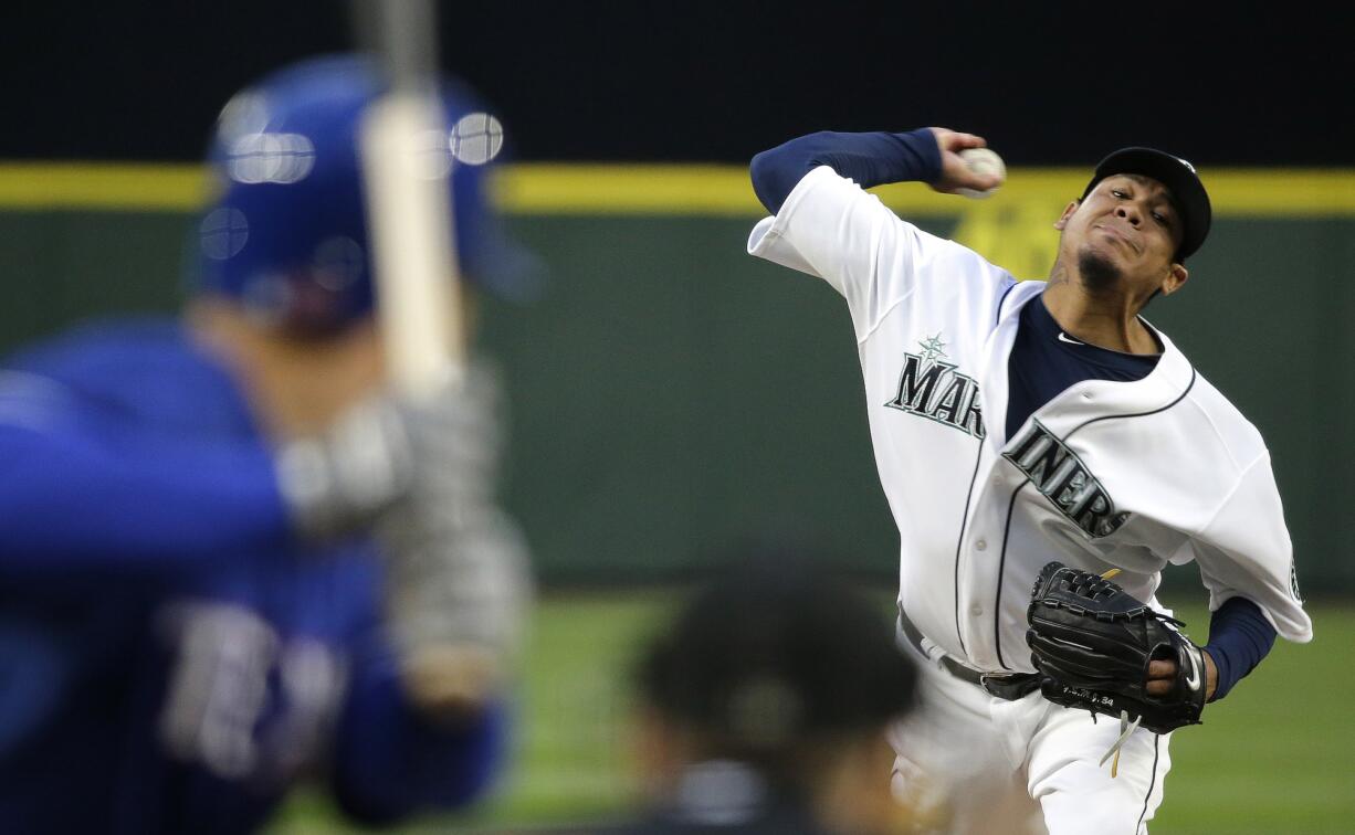 Seattle Mariners starting pitcher Felix Hernandez throws to a Texas Rangers batter during the fifth inning Saturday, April 18, 2015, in Seattle.