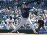 Tampa Bay Rays starting pitcher Jake Odorizzi throws against the Seattle Mariners on Wednesday, May 14, 2014, in the first inning of a baseball game in Seattle.