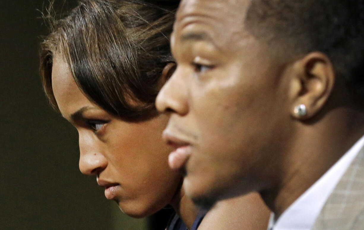 Janay Rice, left, listens as her husband, Baltimore Ravens running back Ray Rice, speaks to the media during a news conference in Owings Mills, Md., on May 23.