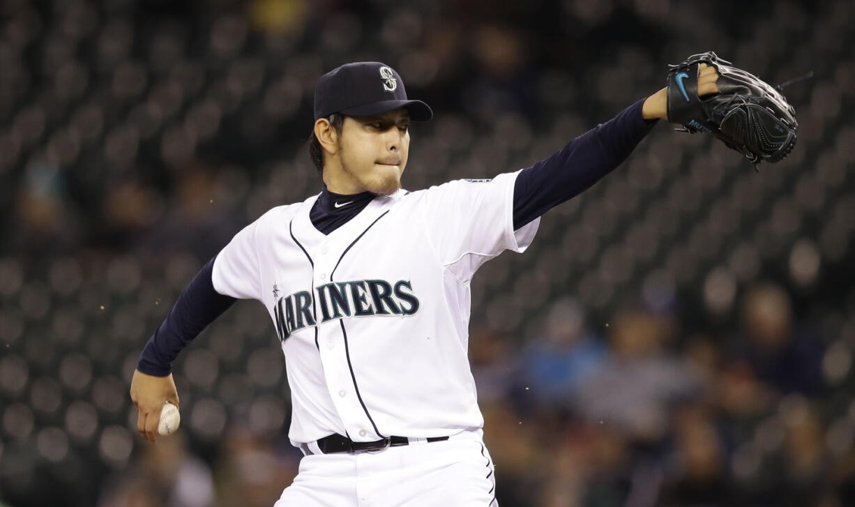 Seattle Mariners starting pitcher Hisashi Iwakuma scattered four hits over eight innings Thursday with seven strikeouts and no walks against Kansas City.