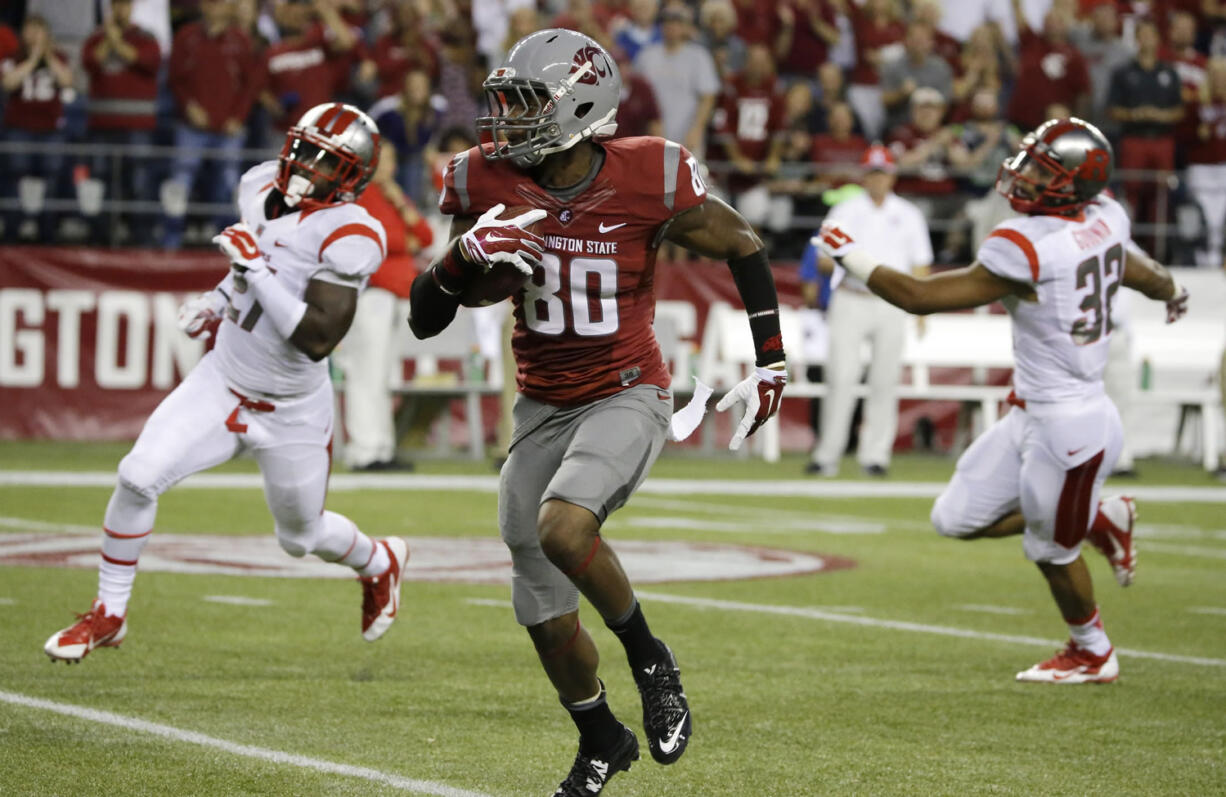 Washington State wide receiver Dom Williams (80) runs during a 64-yard reception in the first half of an NCAA college football game against Rutgers, Thursday, Aug. 28, 2014, in Seattle.