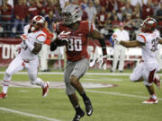 Washington State wide receiver Dom Williams (80) runs during a 64-yard reception in the first half of an NCAA college football game against Rutgers, Thursday, Aug. 28, 2014, in Seattle.