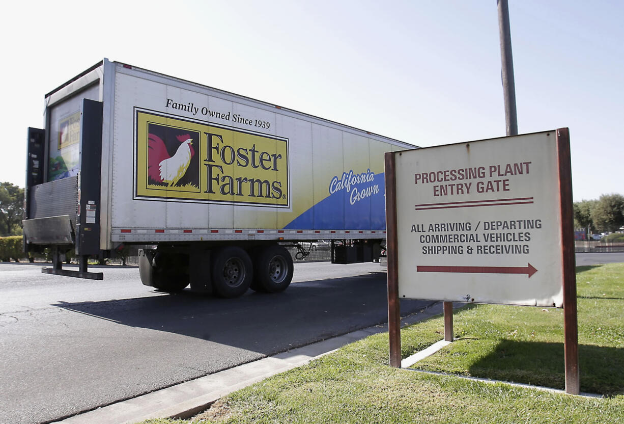 A truck enters the Foster Farms processing plant in Livingston, Calif.