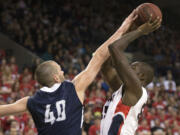 San Diego forward Dennis Kramer (40) tries to block a shot by Gonzaga forward Sam Dower (35) during the first half Thursday at the McCarthey Athletic Center.