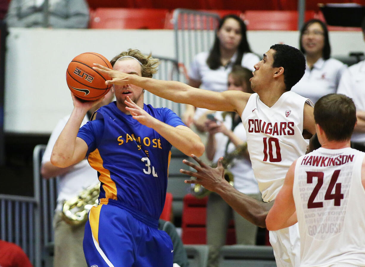 Washington State's Dexter Kernich-Drew (10) challenges a pass by San Jose State's Andrew Vollert during the second half in Pullman on Sunday, Dec. 21, 2014. Washington State won 82-53.