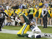 Green Bay Packers' Richard Rodgers catches a touchdown pass in front of Seattle Seahawks' Cary Williams during the second half of an NFL football game Sunday, Sept. 20, 2015, in Green Bay, Wis.