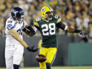 Green Bay Packers' Sean Richardson (28) breaks up a pass intended for Seattle Seahawks' Jimmy Graham during the first half Sunday, Sept. 20, 2015, in Green Bay, Wis.