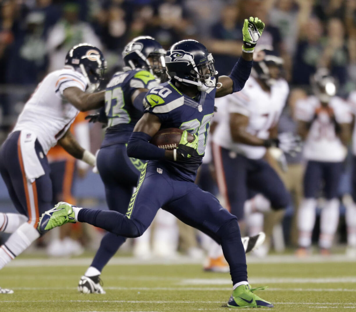 Seattle Seahawks' Jeremy Lane (20) runs after intercepting a Chicago Bears pass late in the first half of a preseason in August. Lane was put on the injured reserve list, adding some question to the depth of the Seahawks' secondary going forward.