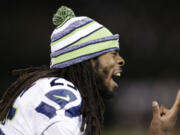 Seattle Seahawks cornerback Richard Sherman yells on the sideline during the second half of an NFL preseason football game against the Oakland Raiders in Oakland, Calif., Thursday, Aug. 28, 2014.