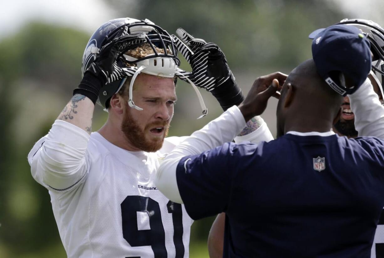 Seattle Seahawks' Cassius Marsh is trying to leave as strong an impression as possible during the three-day rookie camp because he has to return to classes at UCLA.