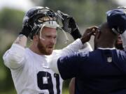 Seattle Seahawks' Cassius Marsh is trying to leave as strong an impression as possible during the three-day rookie camp because he has to return to classes at UCLA.