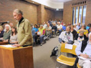 Guemes Island resident and retired pastor Rev Robert Anderson starts off the public comment Wednesday at a The North-West Clean Air Agency public hearing for comments on the renewal of the draft Air Operating Permit for the Shell Refinery at Anacortes.