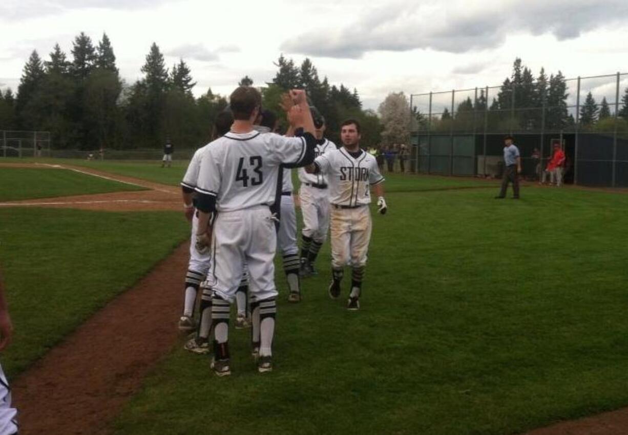 Skyview's Jake Dennis, right, is congratulated after hitting a sacrifice fly in the fifth inning Tuesday against Camas.