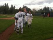 Skyview's Jake Dennis, right, is congratulated after hitting a sacrifice fly in the fifth inning Tuesday against Camas.