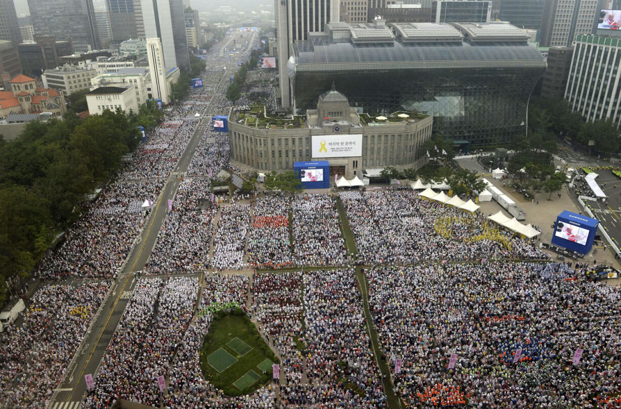 A crowd awaits Pope Francis at the beatification Mass for Paul Yun Ji-Chung and his 123 martyr companions today in Seoul, South Korea.