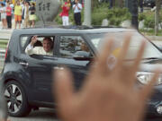 Pope Francis waves from a car Thursday in Seongnam, South Korea.