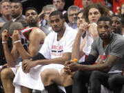 From left, Portland Trail Blazers' Nicolas Batum, Dorell Wright, LaMarcus Aldridge, Robin Lopez, Thomas Robinson and Wesley Matthews watch from the bench in the final minute of their Game 3 loss to San Antonio.