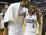 Portland's LaMarcus Aldridge, left, and Will Barton (5) walk off the court after the Game 4 victory.