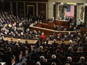 Congress and guests listen to President Barack Obama's report on the State of the Union, Tuesday, Jan.