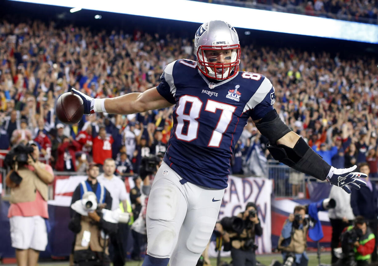 New England Patriots tight end Rob Gronkowski celebrates his first touchdown against the Pittsburgh Steelers on Thursday, Sept. 10, 2015, in Foxborough, Mass.