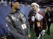 Phillip Hajszan interviews Seattle Seahawks' Bruce Irvin during media day for the NFL Super Bowl XLVIII football game Tuesday, Jan. 28, 2014, in Newark, N.J.