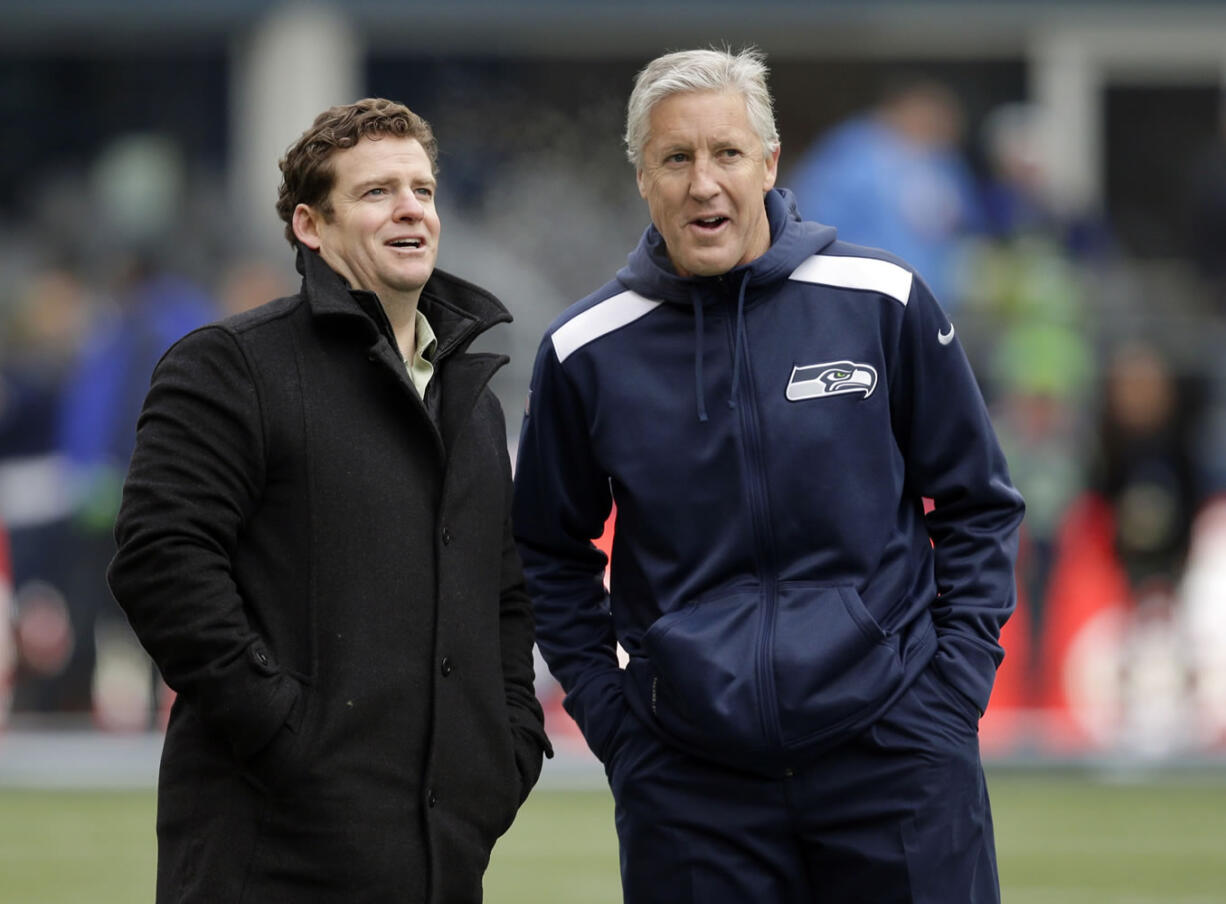 Seattle Seahawks head coach Pete Carroll, right, and general manager John Schneider.