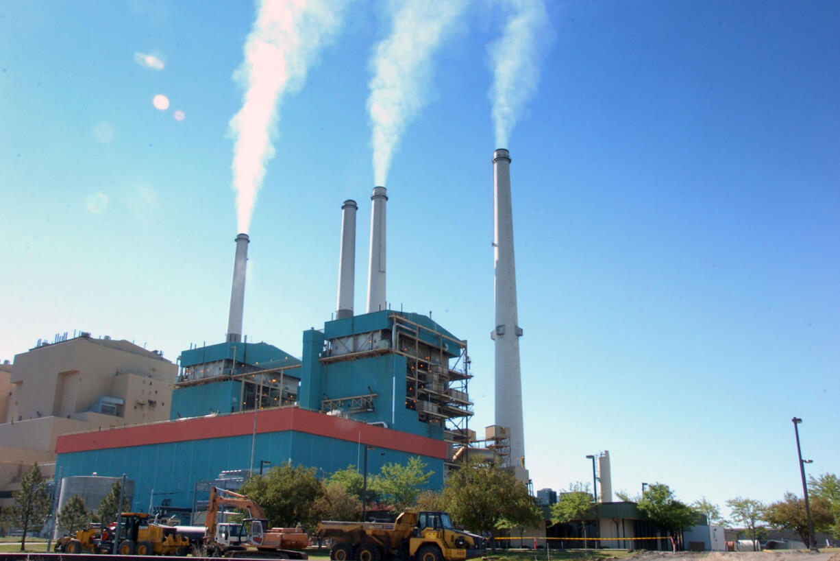 Smoke rises from the Colstrip Steam Electric Station, a coal burning power plant July 1, 2013, in Colstrip, Mont.