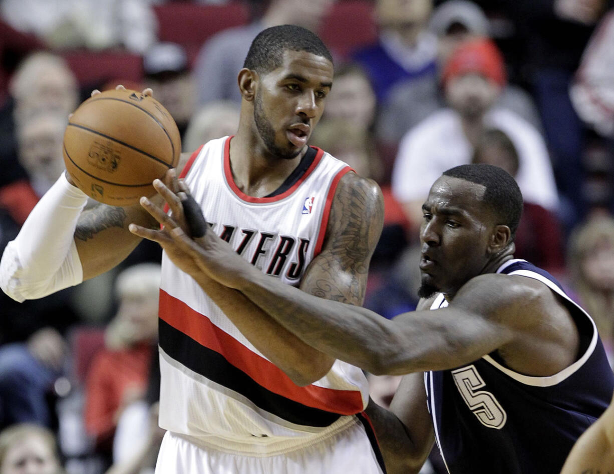 Oklahoma City Thunder center Kendrick Perkins, right, reaches in on Portland Trail Blazers forward LaMarcus Aldridge during the first half of an NBA basketball game in Portland, Ore., Tuesday, Feb. 11, 2014.