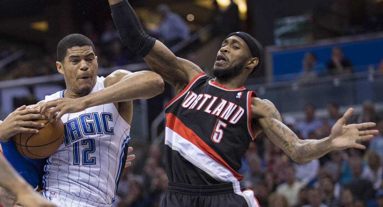 Orlando's Tobias Harris (12) fights for a defensive rebound with Portland's Will Barton (5) during the second half Tuesday.