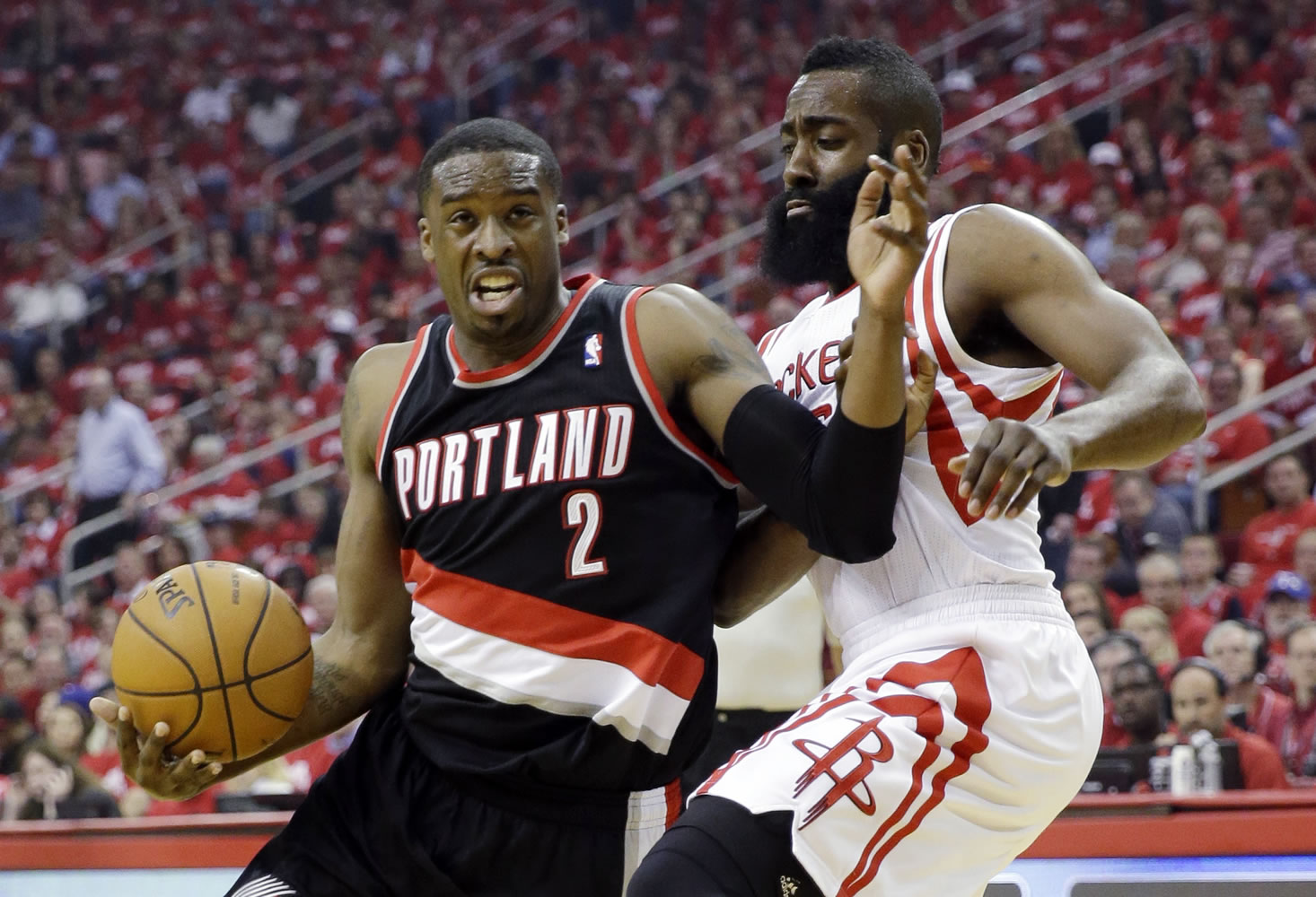 Portland Trail Blazers' Wesley Matthews (2) tries to drive past Houston Rockets' James Harden during the first half in Game 1 of an opening-round NBA basketball playoff series Sunday in Houston.