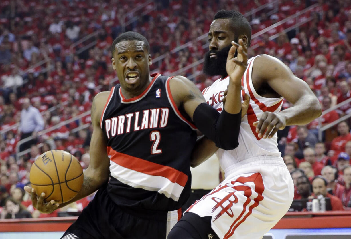 Portland Trail Blazers' Wesley Matthews (2) tries to drive past Houston Rockets' James Harden during the first half in Game 1 of an opening-round NBA basketball playoff series Sunday in Houston.