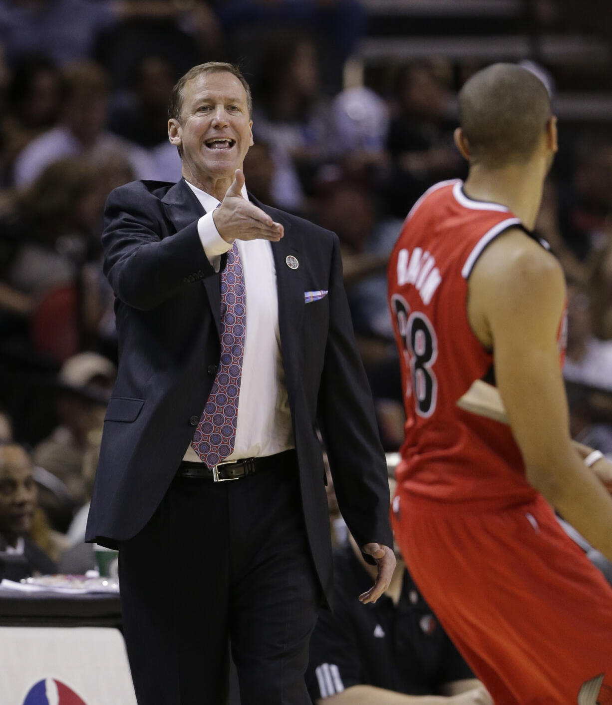 Portland Trail Blazers coach Terry Stotts, left, calls to his players during the first half of Game 5 against the San Antonio Spurs.