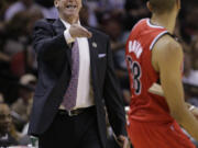 Portland Trail Blazers coach Terry Stotts, left, calls to his players during the first half of Game 5 against the San Antonio Spurs.