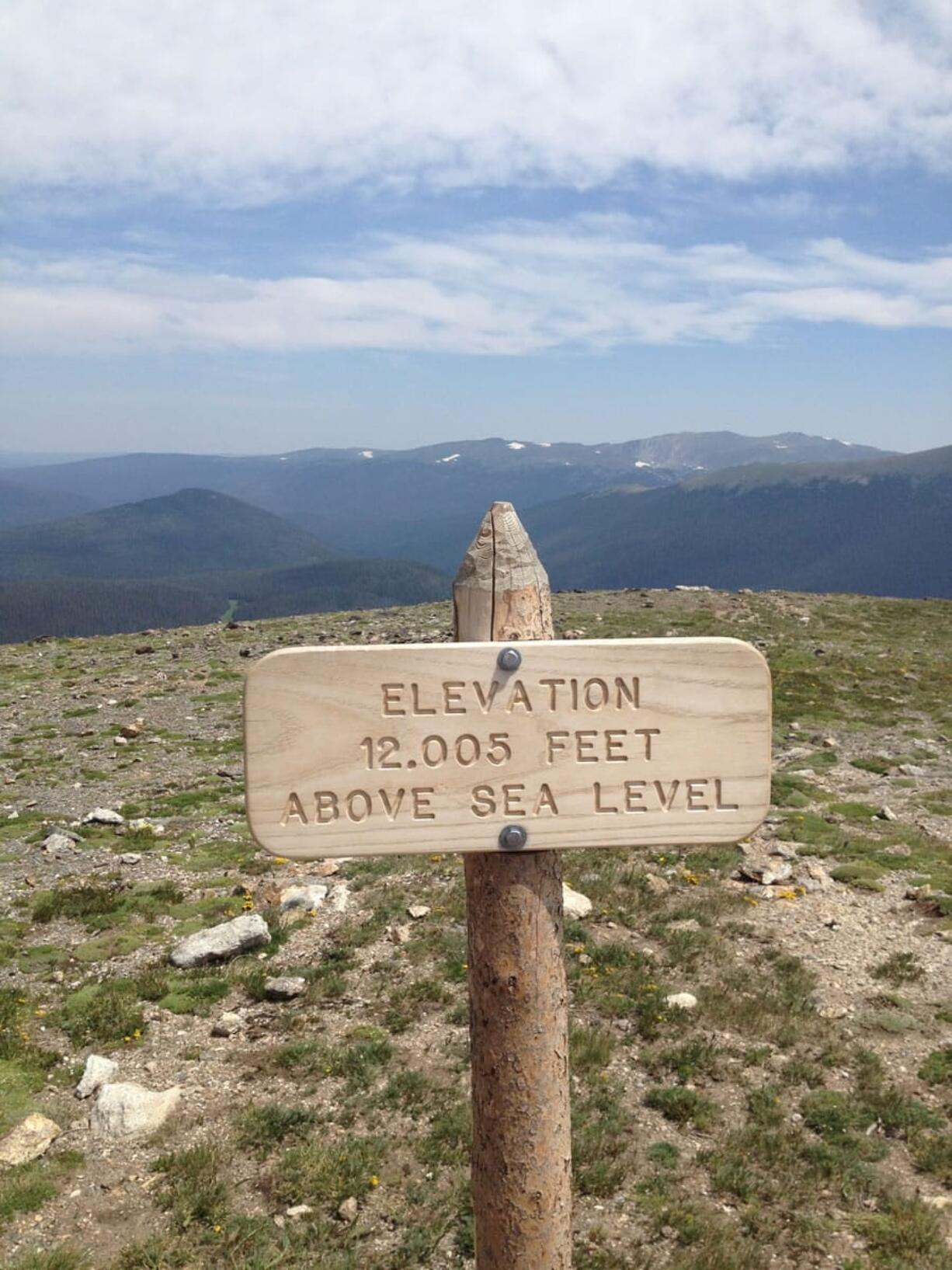 An elevation sign is posted a short hike up from the Alpine Visitor Center on the edge of the eastern side of Rocky Mountain National Park in Colorado. There are several good day hikes in this region of the park, using the town of Estes Park as a gateway.