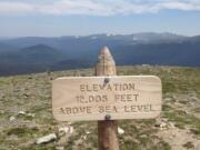 An elevation sign is posted a short hike up from the Alpine Visitor Center on the edge of the eastern side of Rocky Mountain National Park in Colorado. There are several good day hikes in this region of the park, using the town of Estes Park as a gateway.