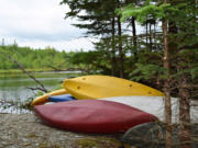 Kayaks and canoes are ready for guests of Trout Point Lodge in Nova Scotia, Canada, to use Aug.