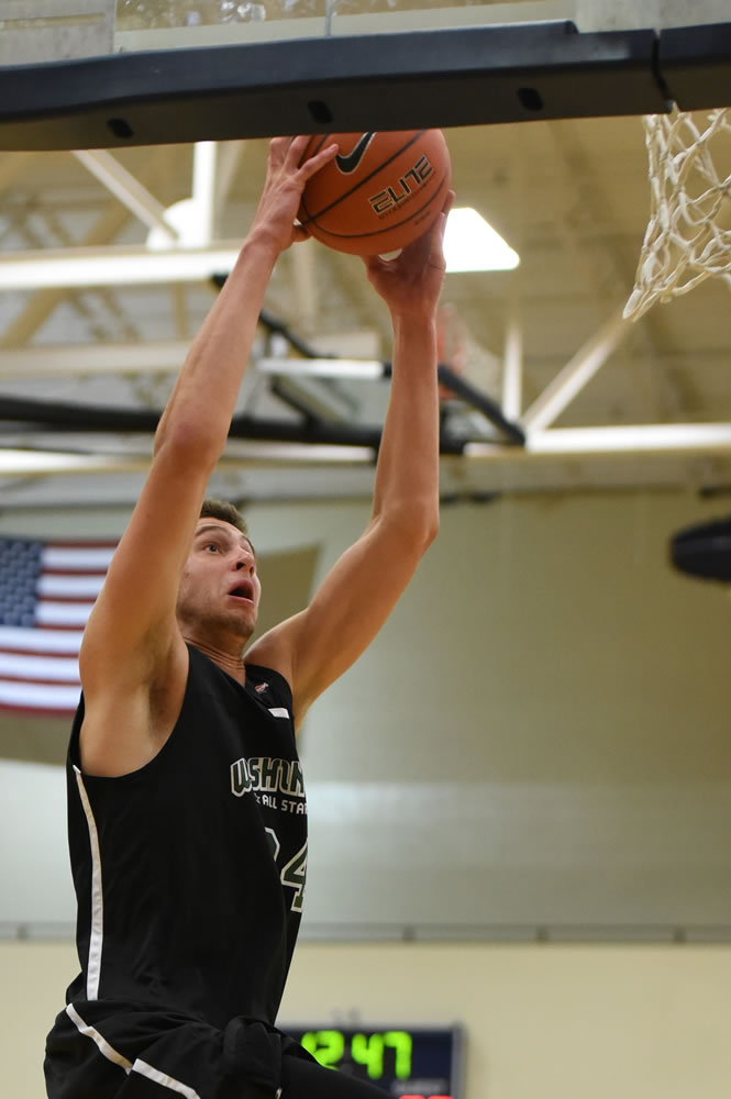 Camas senior Trevor Jasinsky throws down a dunk during the Northwest Shootout all-star basketball game Saturday in Hillsboro, Ore.