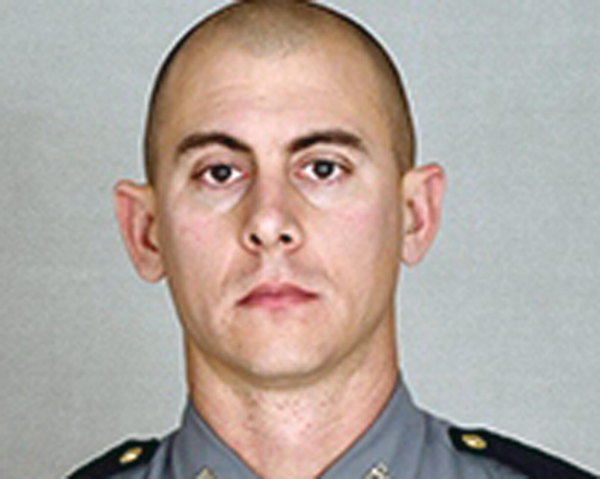 This undated photo provided by the Kentucky State Police shows Trooper Joseph Cameron Ponder. Ponder, who had been on the force less than a year was killed, late Sunday, Sept. 13, 2015, in a shooting during a car chase on Interstate 24, in Kentucky. Authorities are searching for the suspect.