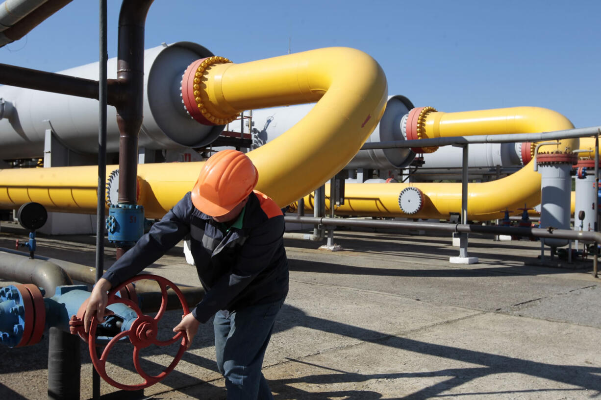 A Ukrainian worker operates a valve in a gas storage point in Bil 'che-Volicko-Ugerske underground gas storage facilities in Strij, outside Lviv, Ukraine, in May.