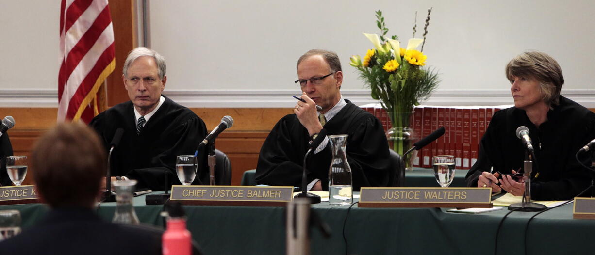 Oregon Supreme Court Chief Justice Thomas A. Balmer, center, questions an attorney during Feb. 15 arguments at the University of Oregon School of Law in Eugene, Ore. He is flanked by Justices Rives Kistler and Martha Walters. The seven-member court heard arguments in two cases with students: State v. Hickman and Doyle v. City of Medford. The justices heard arguments that could reverse Jerrin Lavazie Hickman's murder conviction based on two in-court witness identifications at his trial.