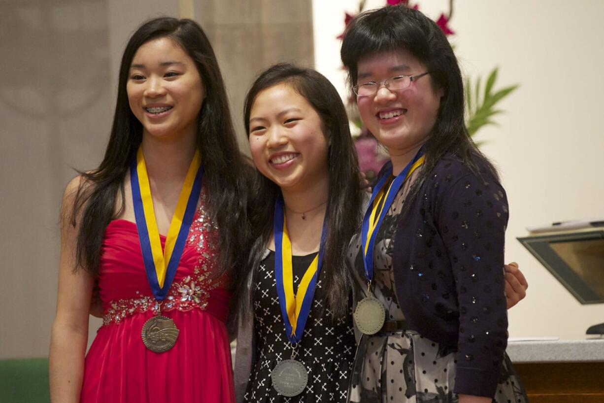 Violinist Fumika Mizuno, 15, from left, pianist Hannah Moon, 16, and pianist Valerie Ding, 16, win gold medals at the Vancouver Symphony Orchestra's 20th Young Artists Competition on Feb.