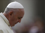 Pope Francis arrives for the weekly general audience in St. Peter's Square at the Vatican on Wednesday.