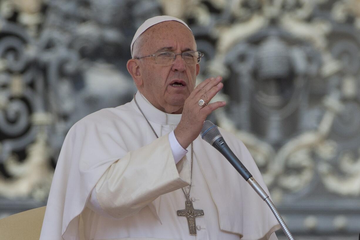 Pope Francis delivers his blessing Wednesday during his weekly general audience in St. Peter's Square at the Vatican.