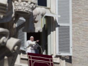 Pope Francis delivers his speech during the Angelus noon prayer he delivered from the window of his studio overlooking St.