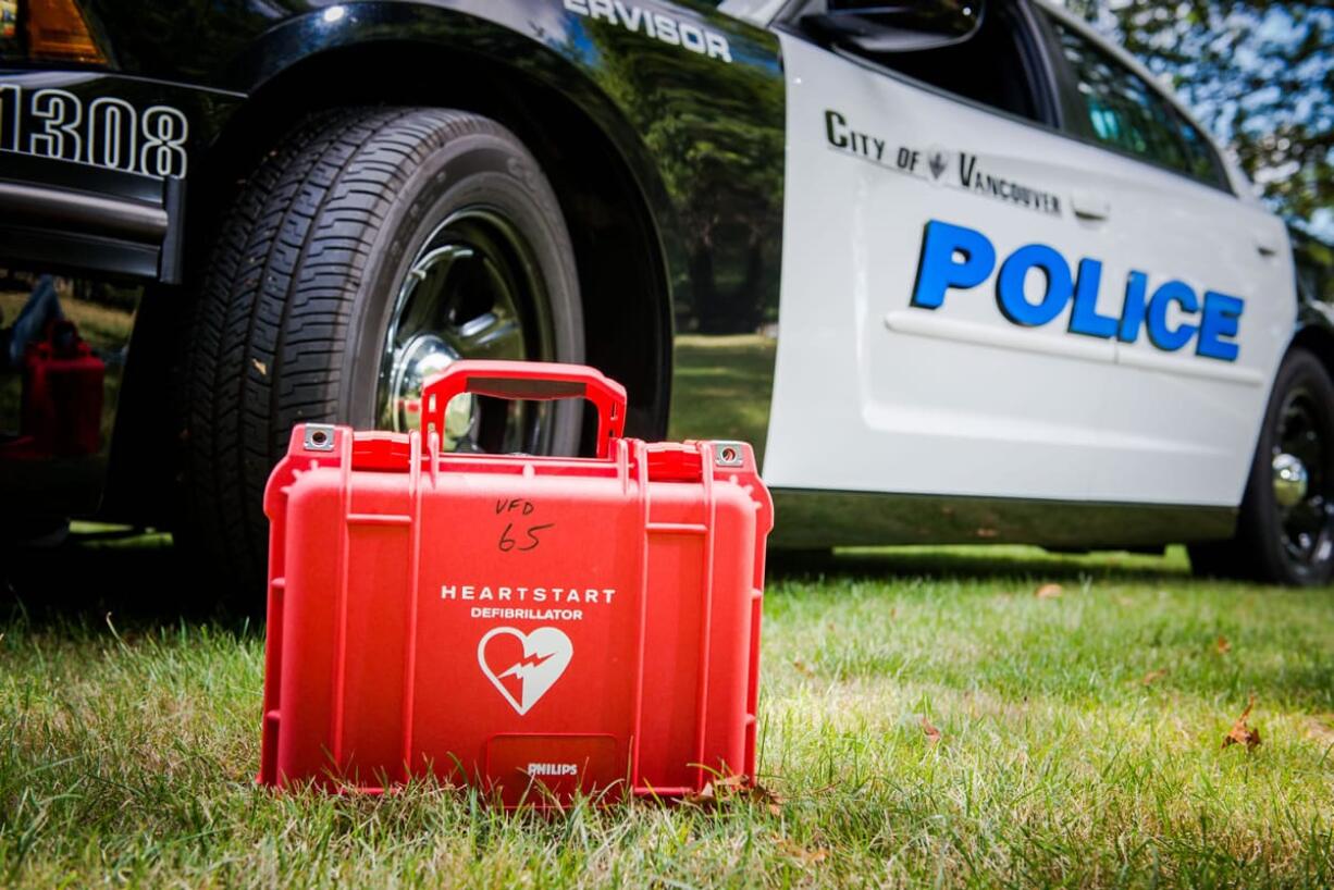 Vancouver police say they've saved their first life since all of its patrol cars were equipped with automated external defibrillators.
