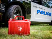 Vancouver police say they've saved their first life since all of its patrol cars were equipped with automated external defibrillators.