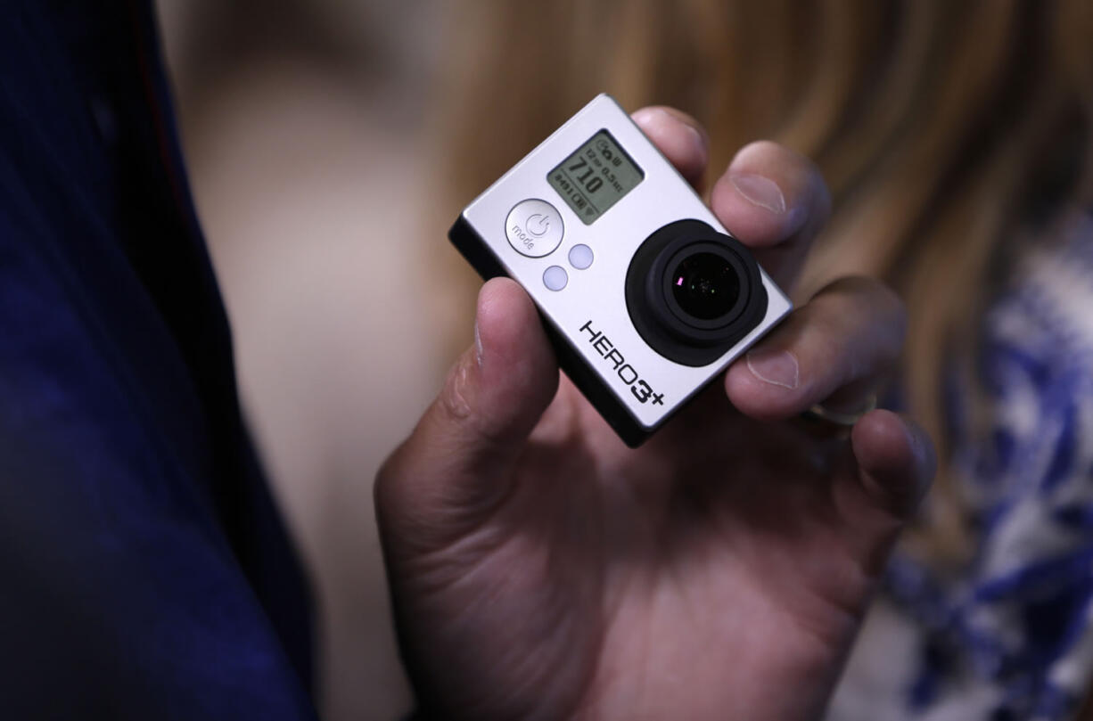 A GoPro camera is held during the GoPro IPO at the Nasdaq MarketSite in New York on Thursday.