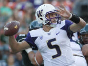 Washington quarterback Jeff Lindquist drops back to pass in the third quarter of an NCAA college football game against Hawaii, Saturday, Aug. 30, 2014, in Honolulu.